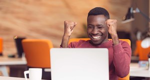 Person on a video call celebrating success